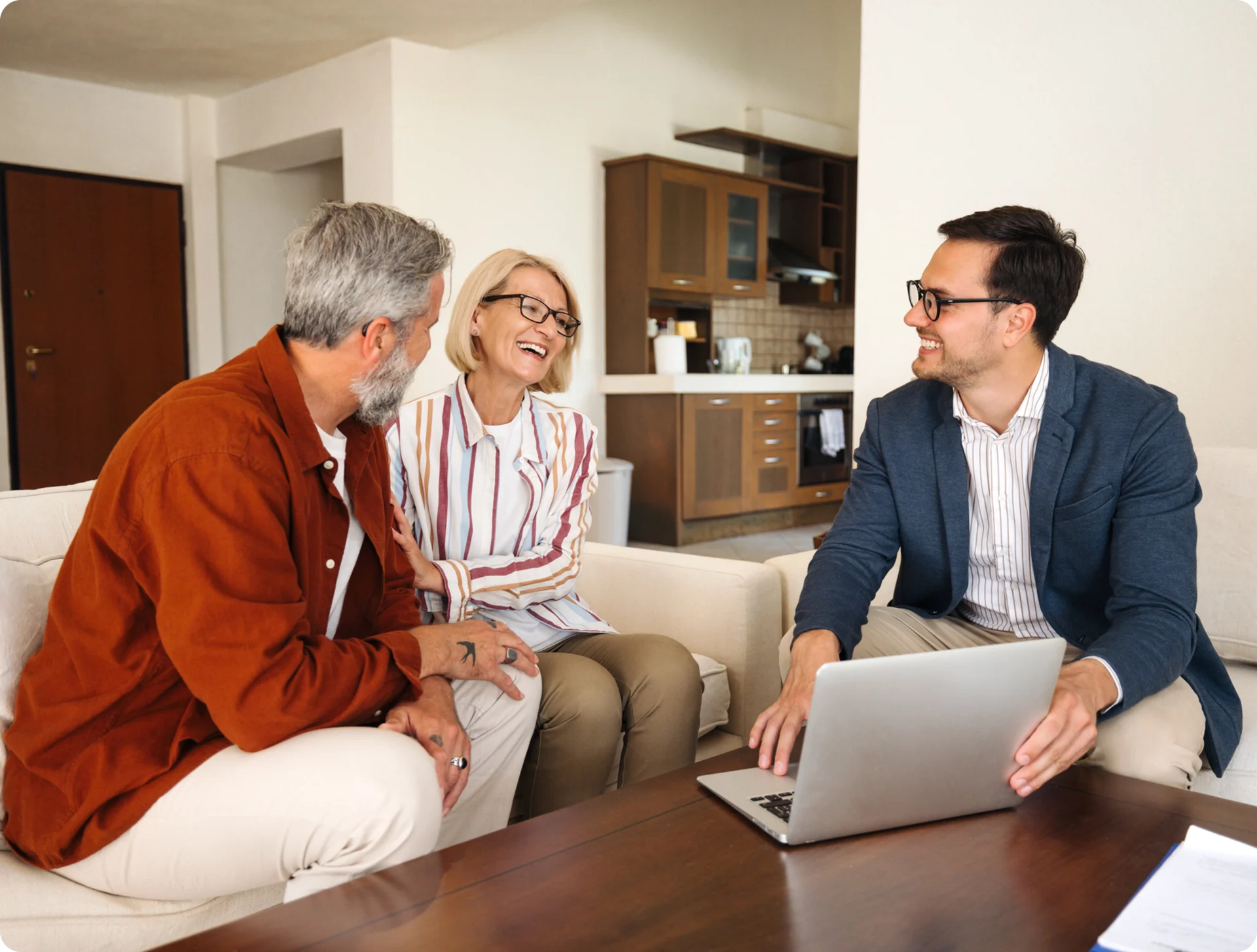 People having a meeting in a living room.